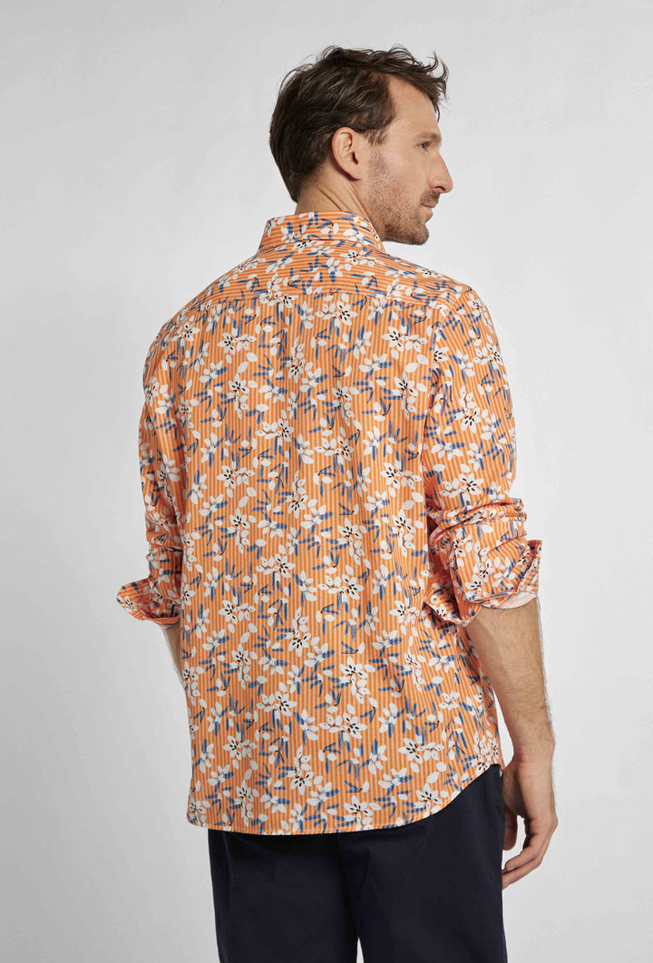Chemise orange avec un motif floral inhabituel blanc et bleu marine