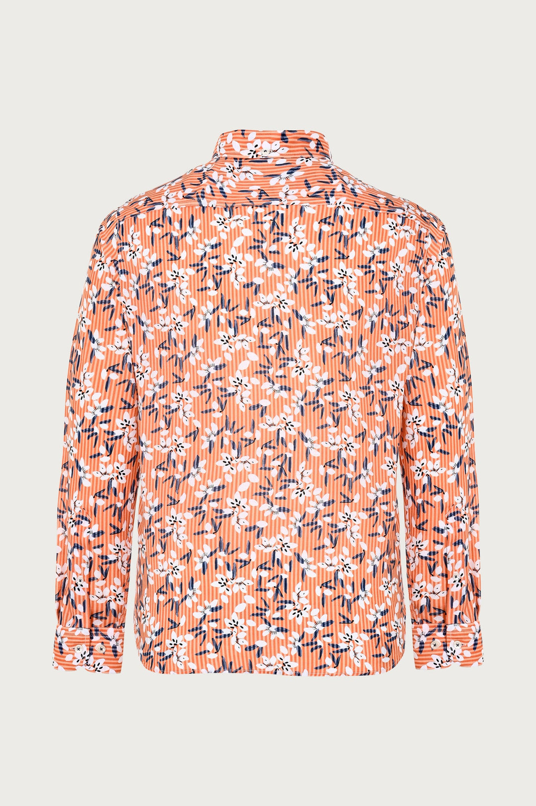Orange shirt with unusual white and navy blue floral pattern