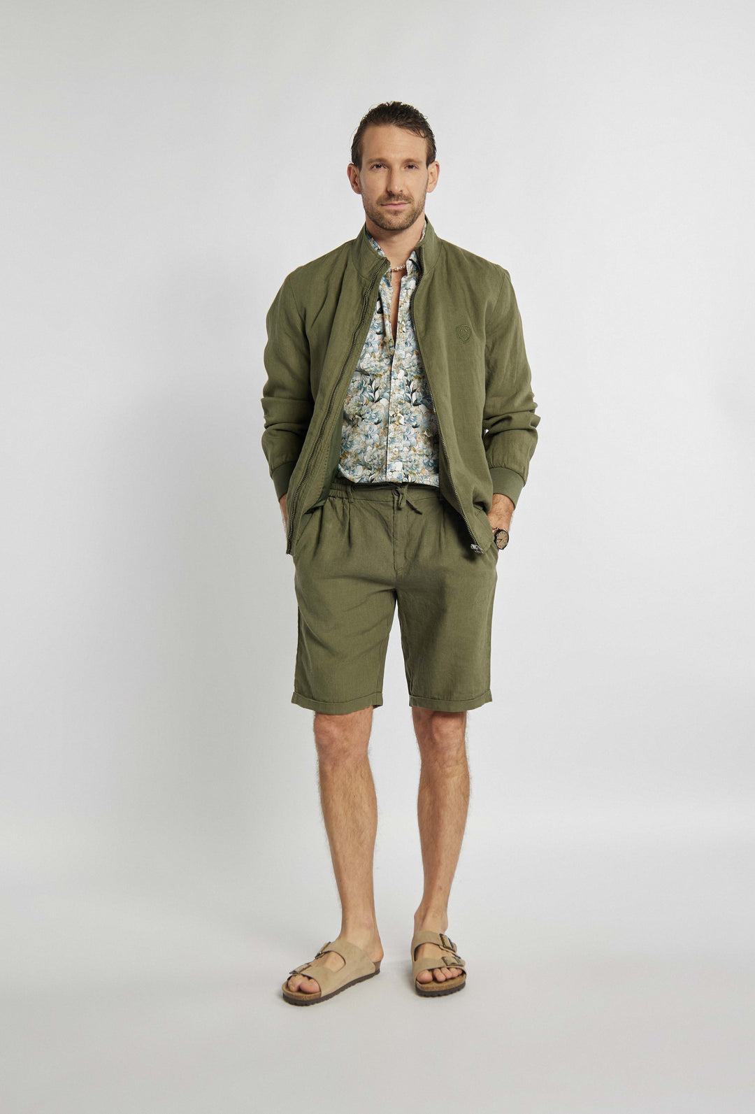 Blouse in khaki color with sigil on chest
