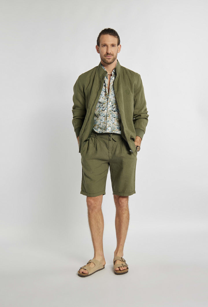 Blouse in khaki color with sigil on chest