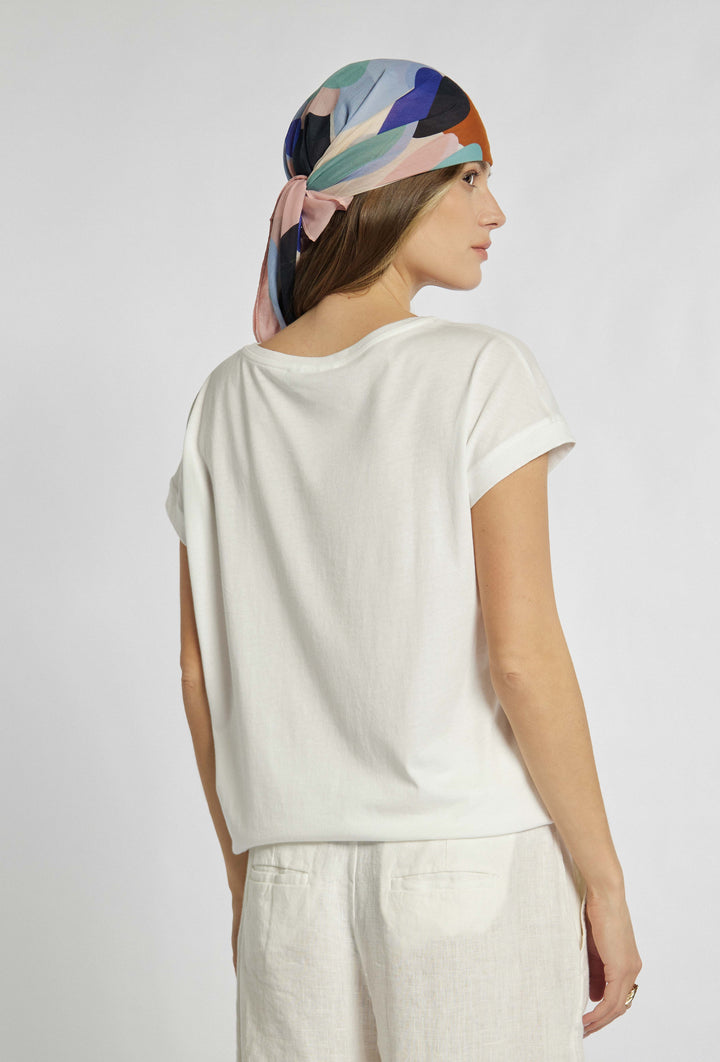 T-Shirt in Ecru-Farbe mit buntem Aufdruck auf der Vorderseite