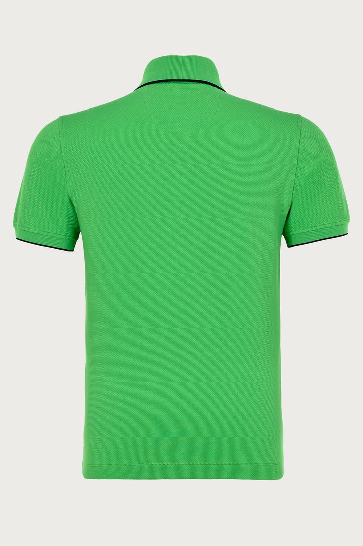 Green polo with brand logo on chest and black fine details