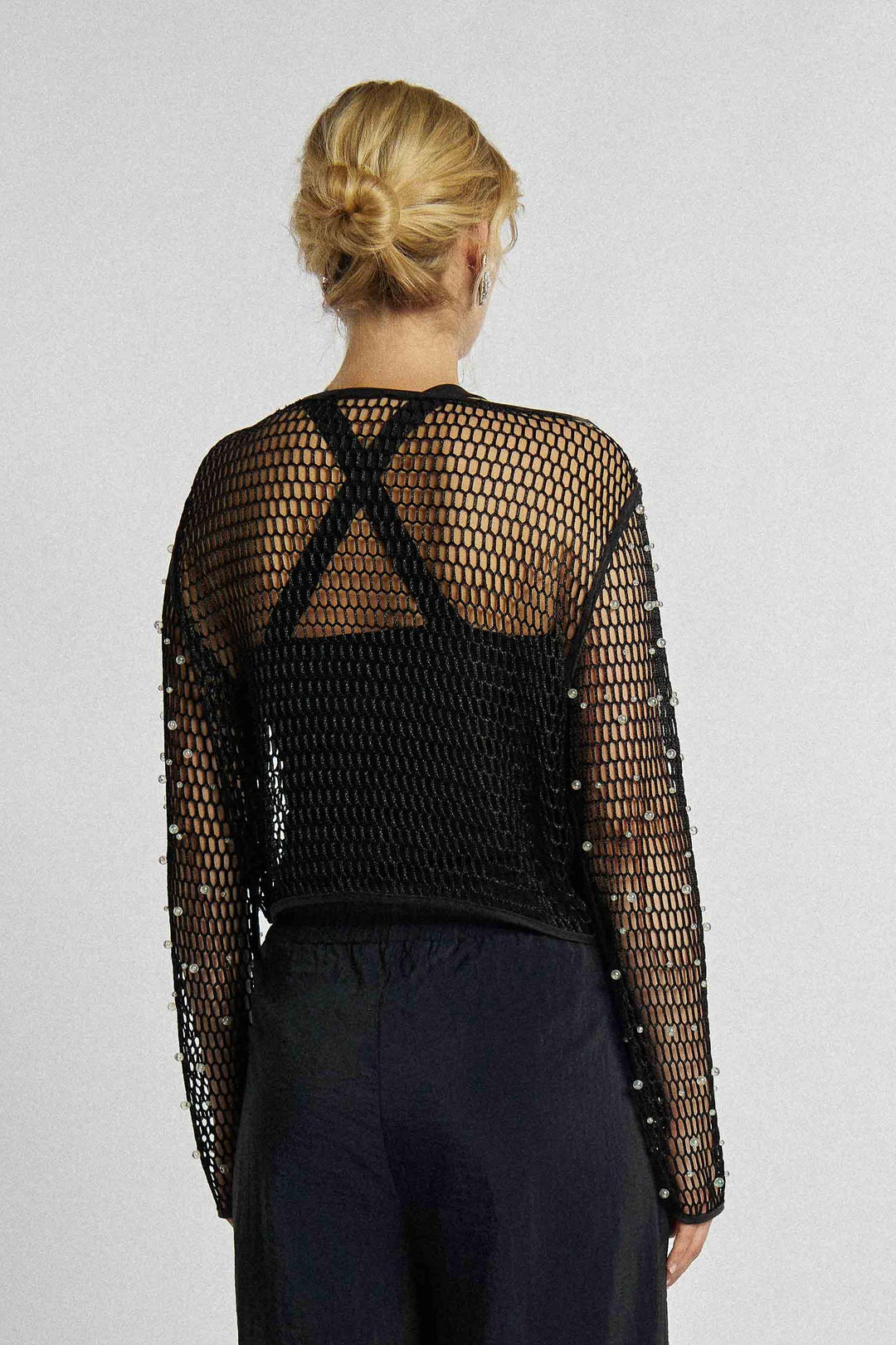 Chemisier en maille de couleur noire avec perles