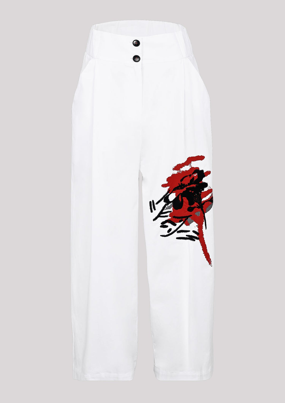Pants in white color with visible print on one leg