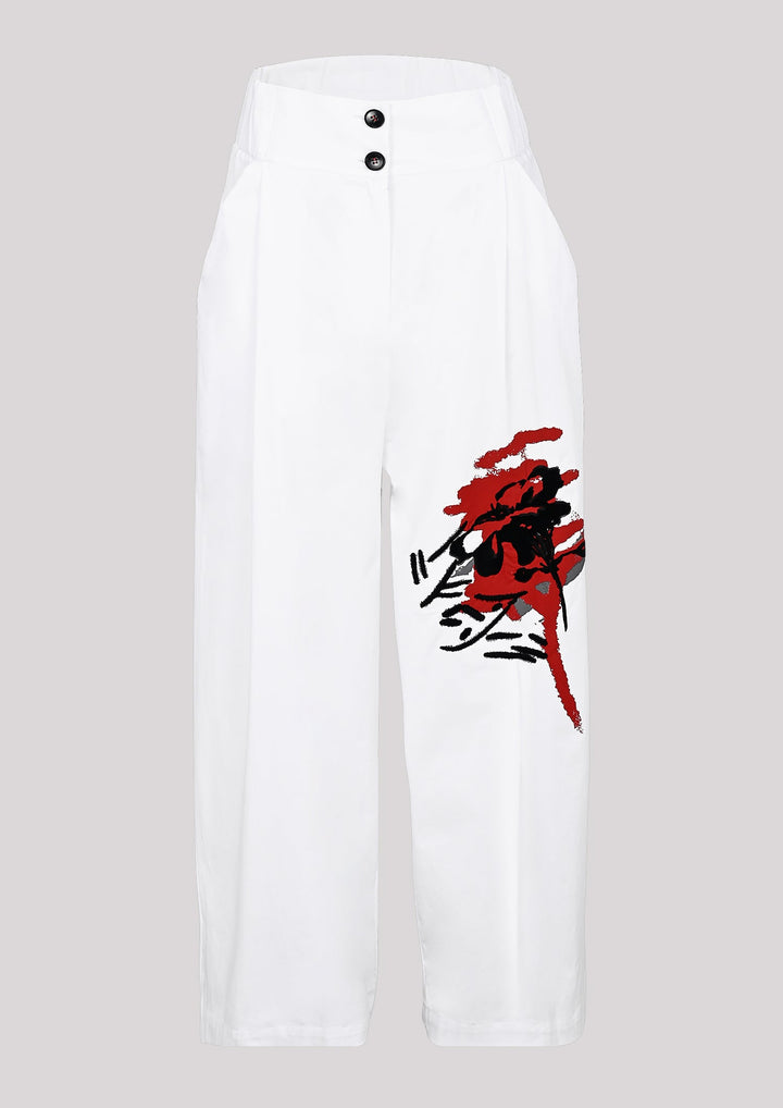 Pants in white color with visible print on one leg