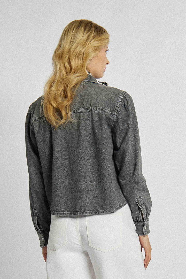 Unbuttoned denim shirt with a shorter cut