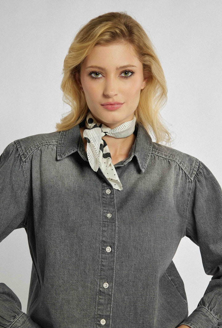 Unbuttoned denim shirt with a shorter cut