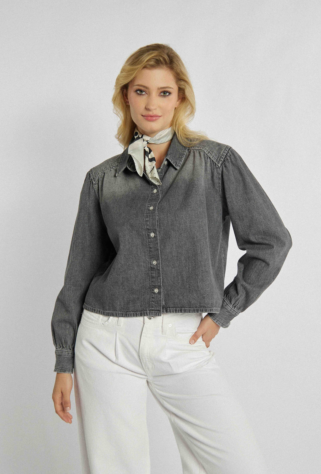 Unbuttoned denim shirt with a shorter cut