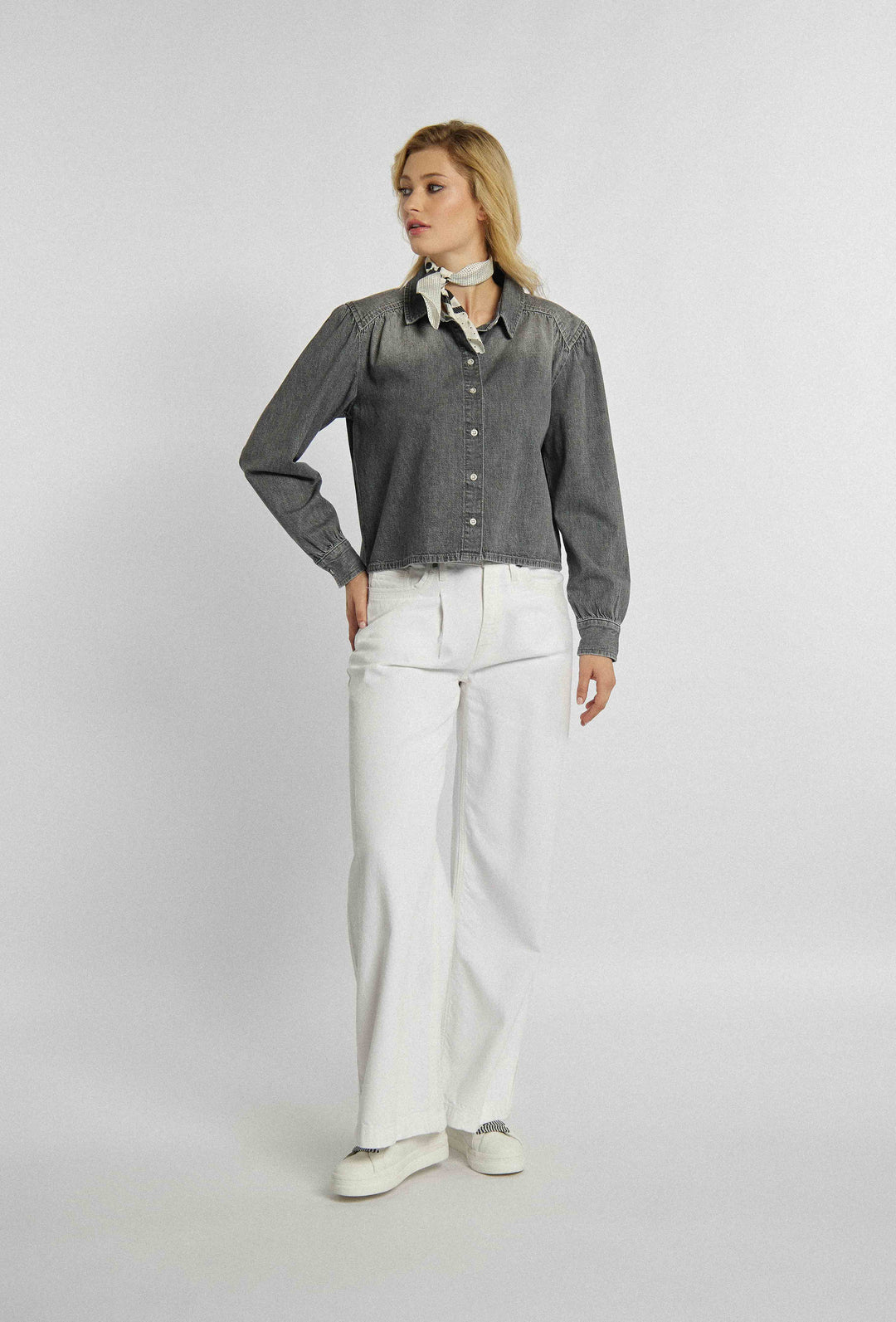 Unbuttoned denim shirt with a shorter cut