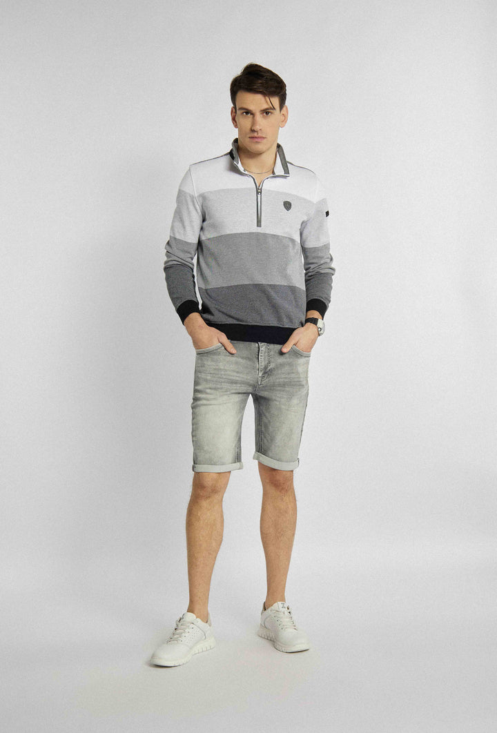 Short light grey pants with rolled up legs and pockets