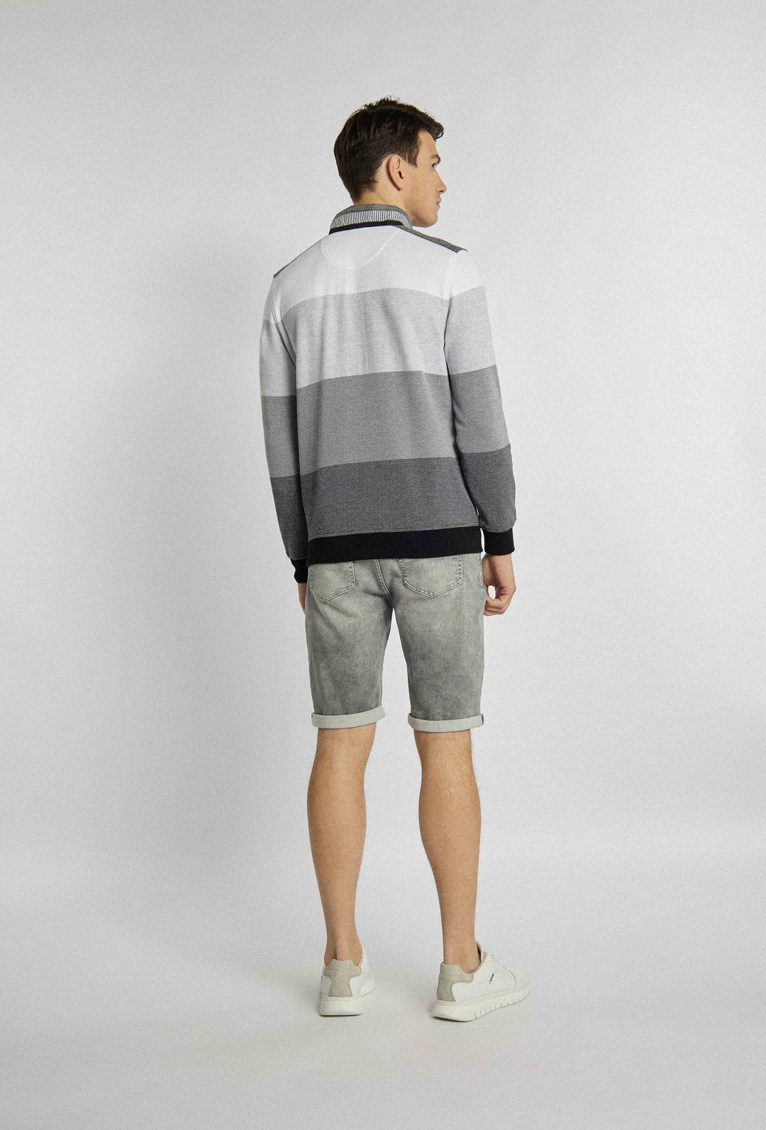 Short light grey pants with rolled up legs and pockets