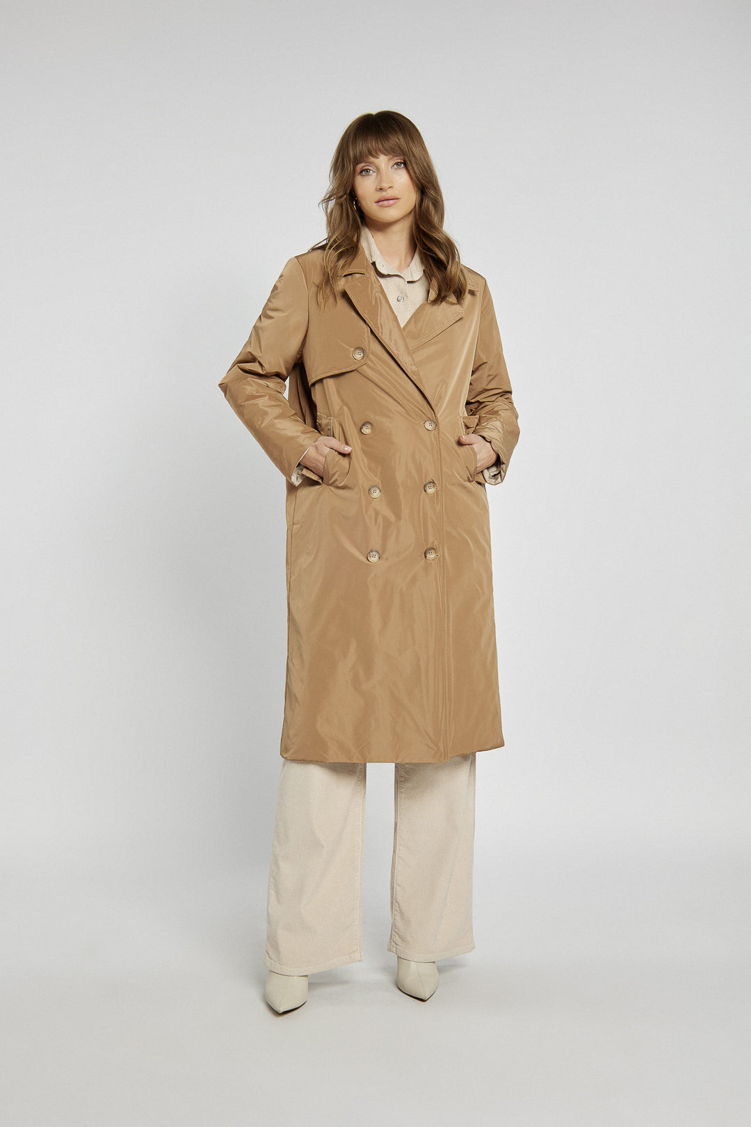 Beige long coat with double-breasted fastening