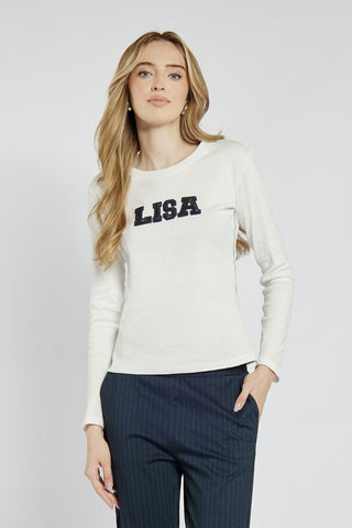 White long-sleeved top with lettering