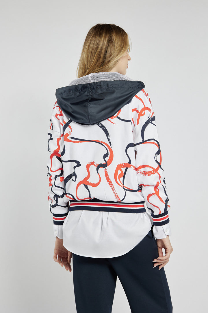White zip-up sweatshirt with abstract patterns