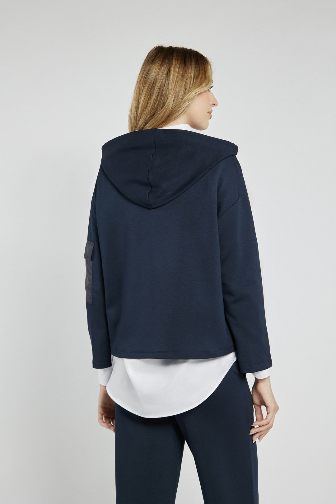 Navy blue sweatshirt with a patch on the sleeve