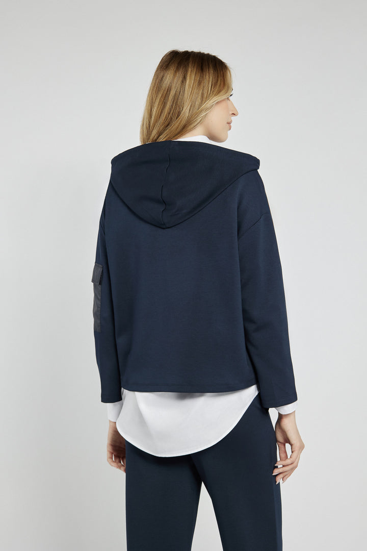 Navy blue sweatshirt with a patch on the sleeve