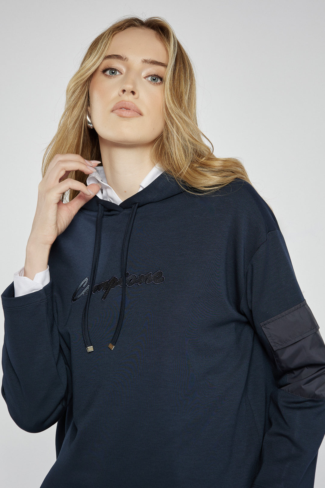 Navy blue sweatshirt with a patch on the sleeve