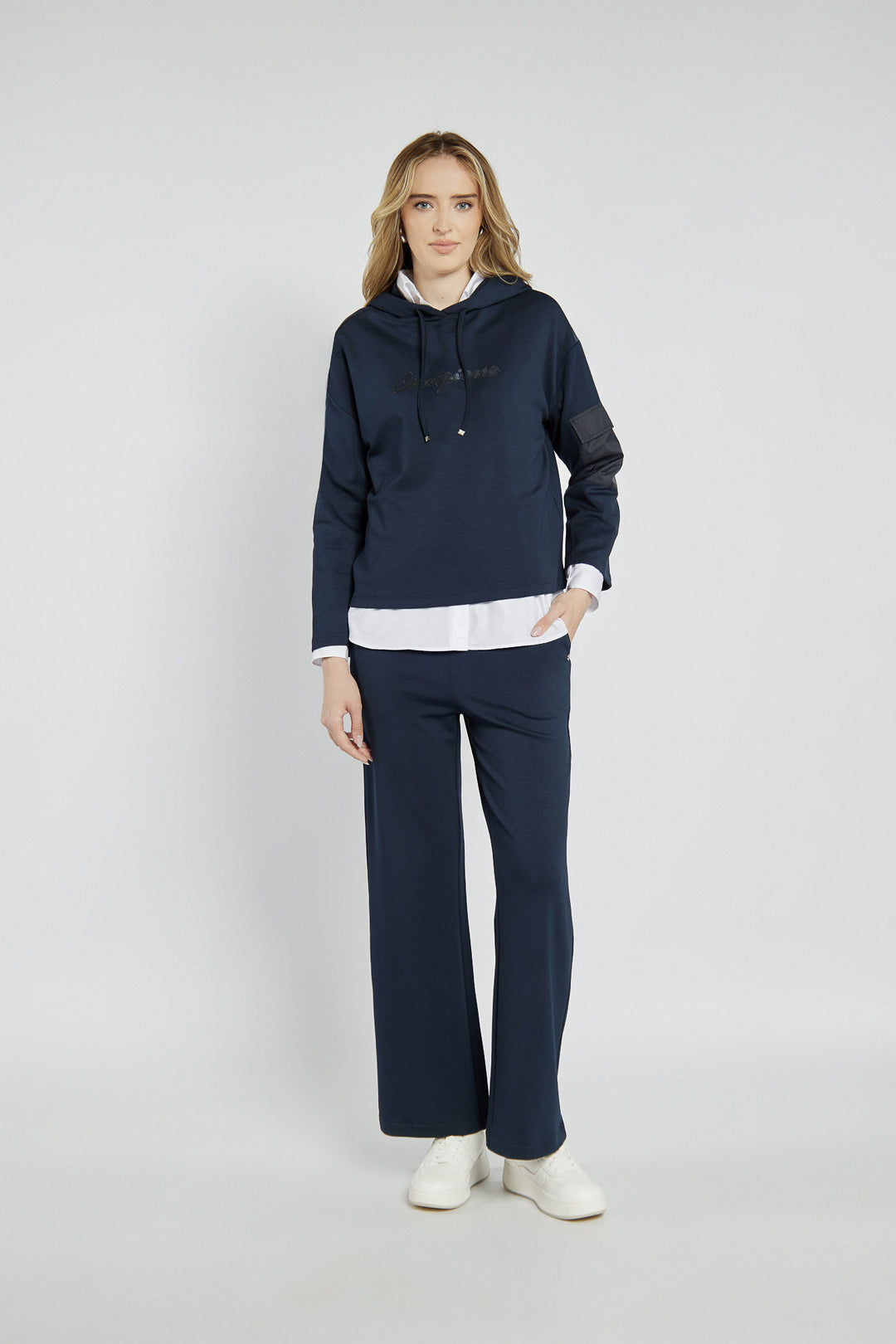Navy blue sweatshirt with a patch on the sleeve