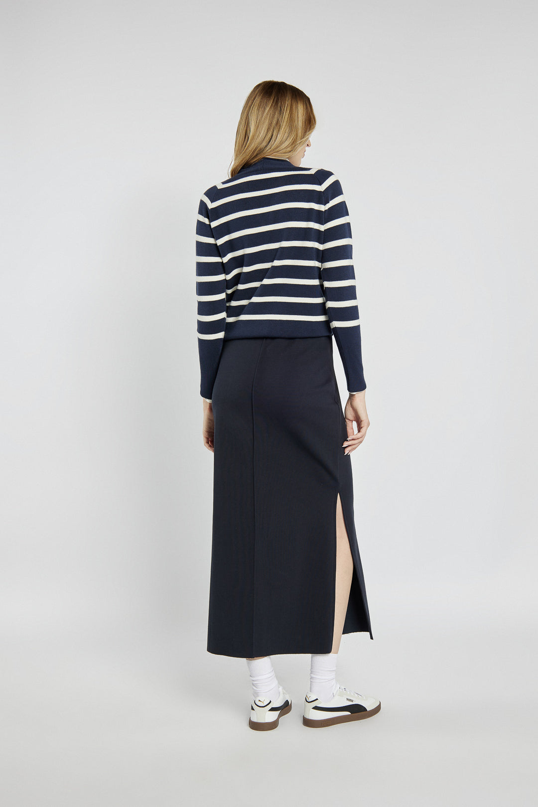 Navy blue knitted midi skirt with a slit