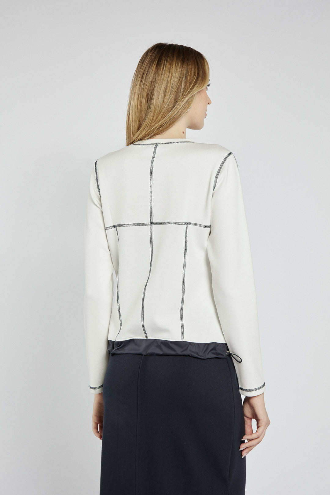 White sweatshirt with black stitching and graphics