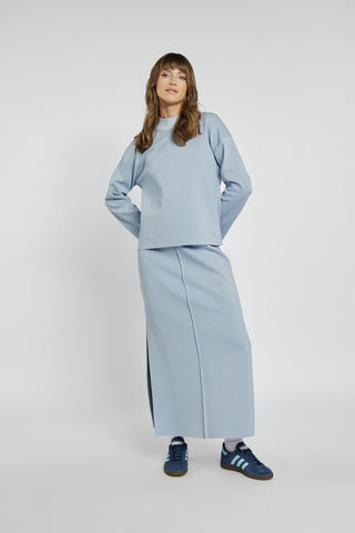 Blue knitted midi skirt with a slit