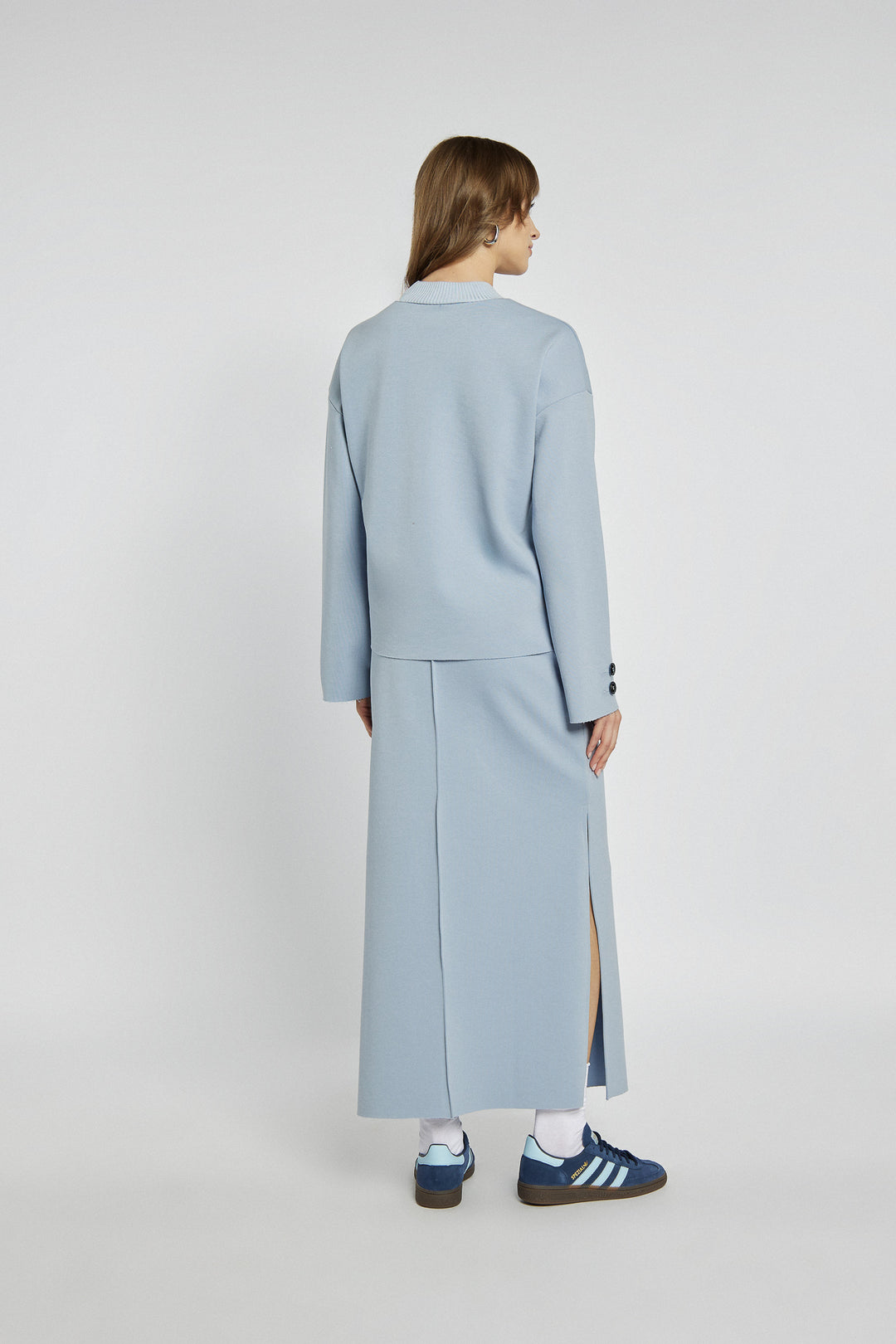 Blue knitted midi skirt with a slit