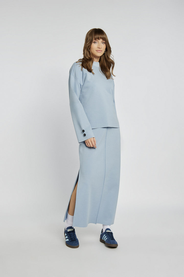 Blue knitted midi skirt with a slit