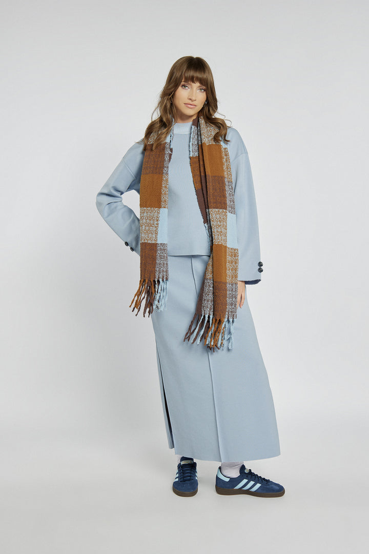 Blue knitted midi skirt with a slit