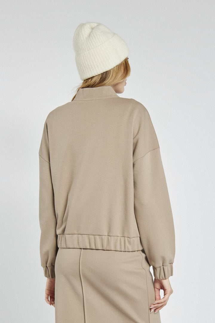 Beige zip-up sweatshirt with decorative stitching