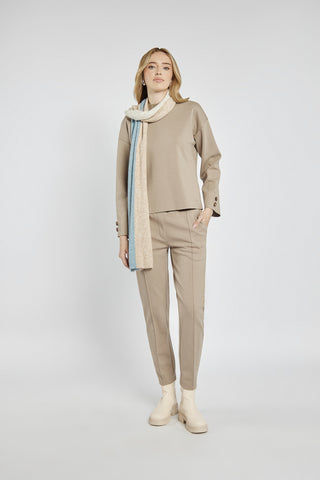 Beige women's pants with creases and an elastic waistband