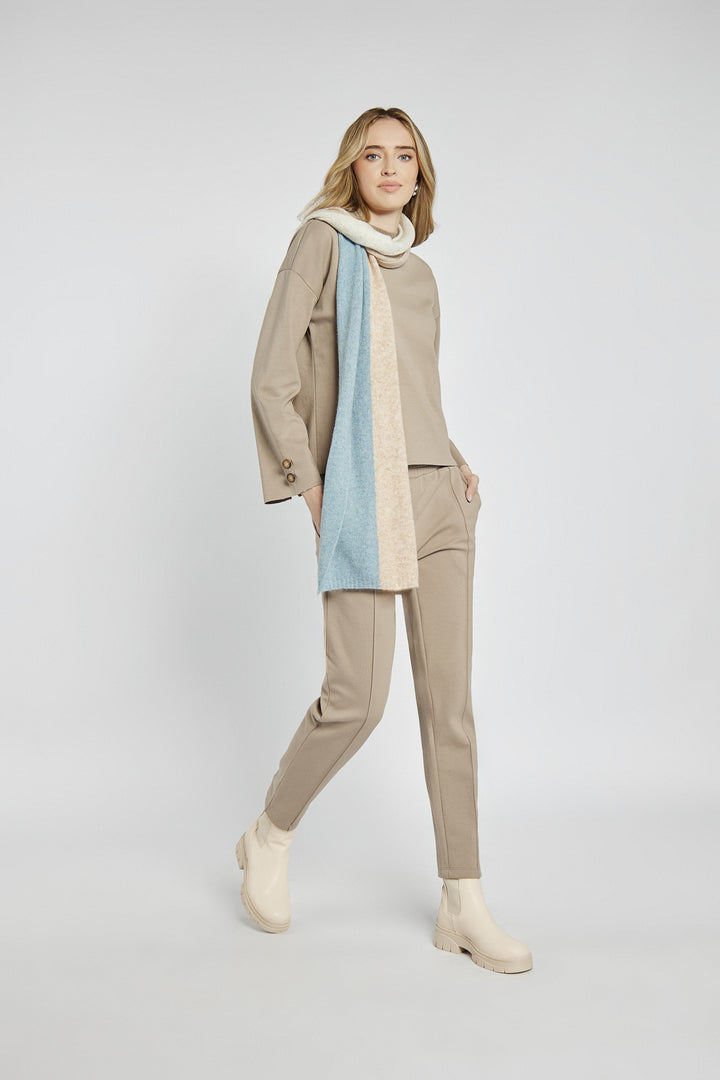 Beige women's pants with creases and an elastic waistband