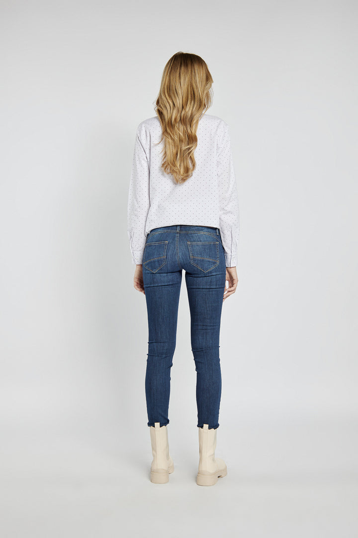 Navy blue jeans with abrasions
