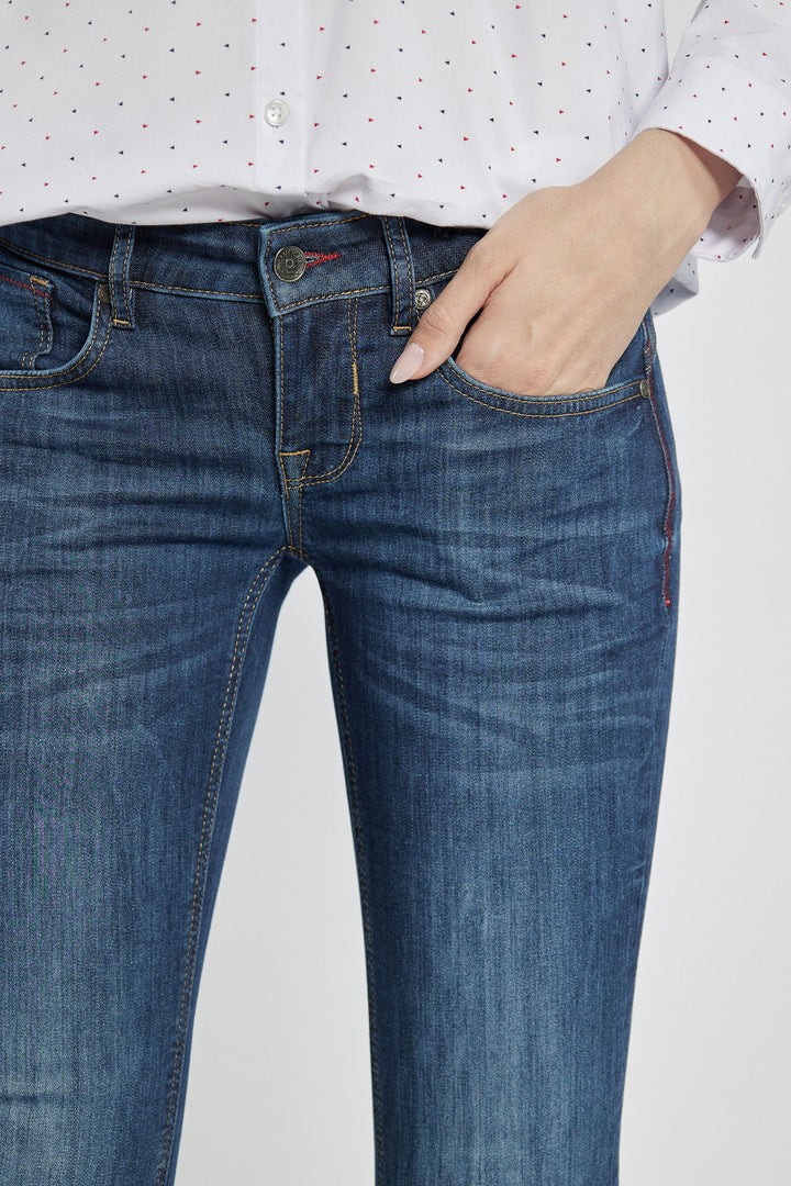 Navy blue jeans with abrasions