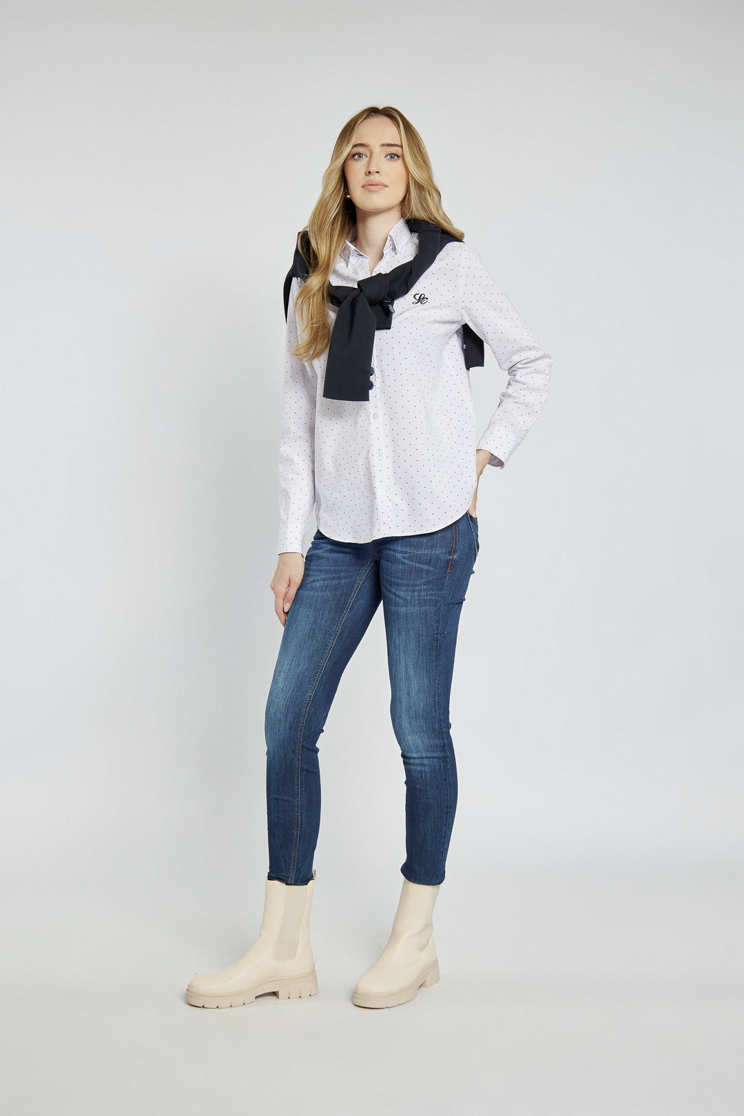 Navy blue jeans with abrasions