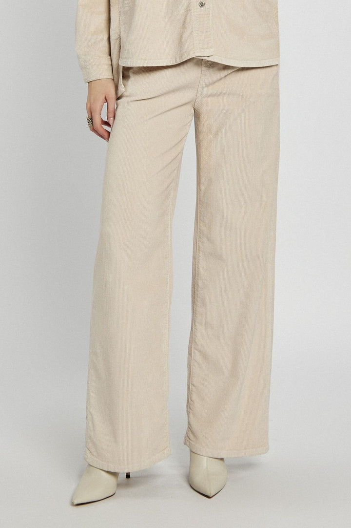 Beige corduroy pants with a straight cut