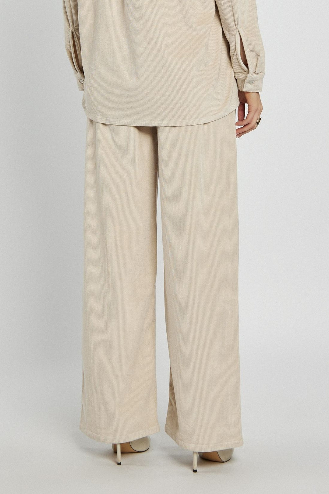 Beige corduroy pants with a straight cut