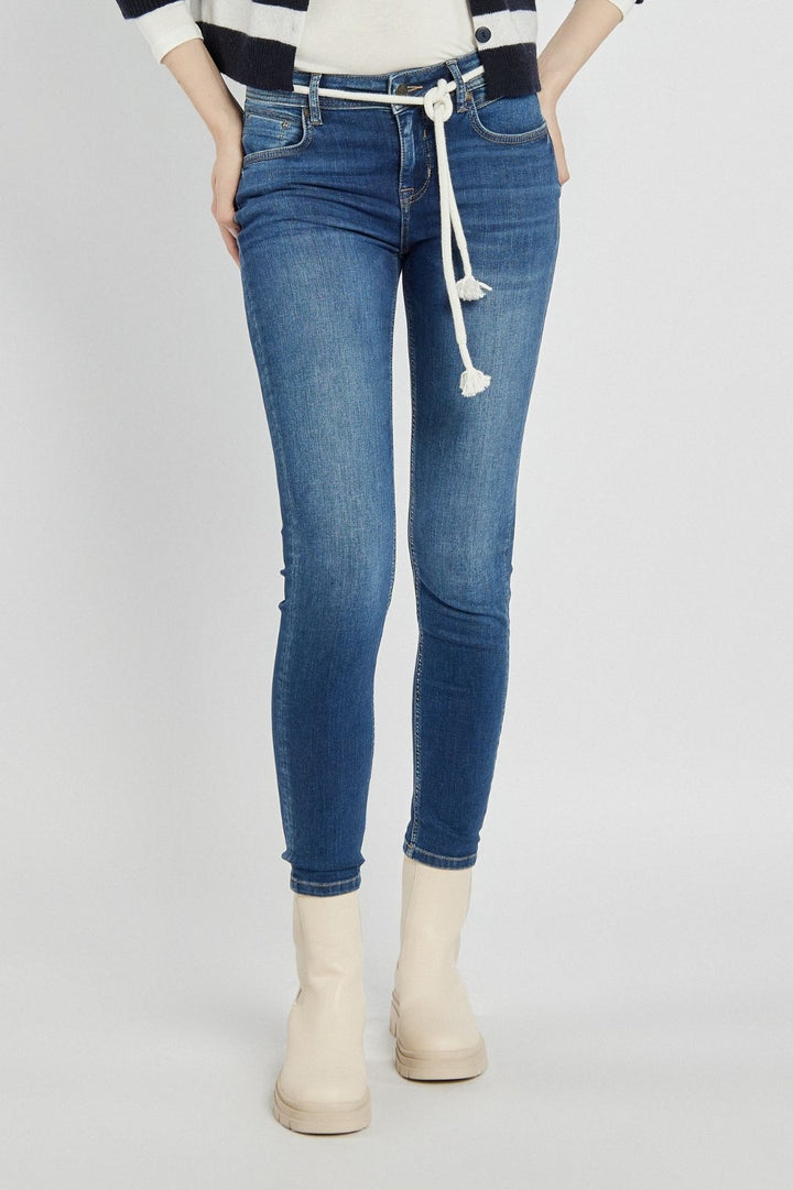Navy blue jeans with a braided belt