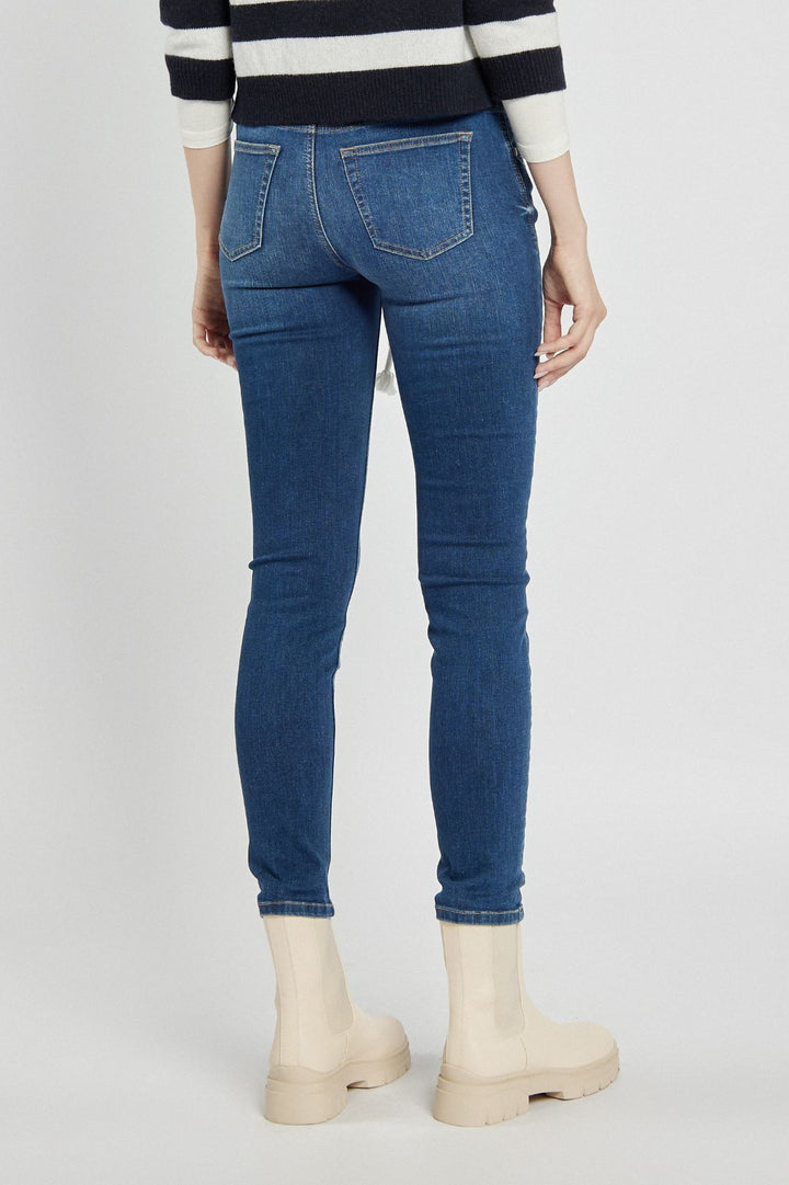 Navy blue jeans with a braided belt