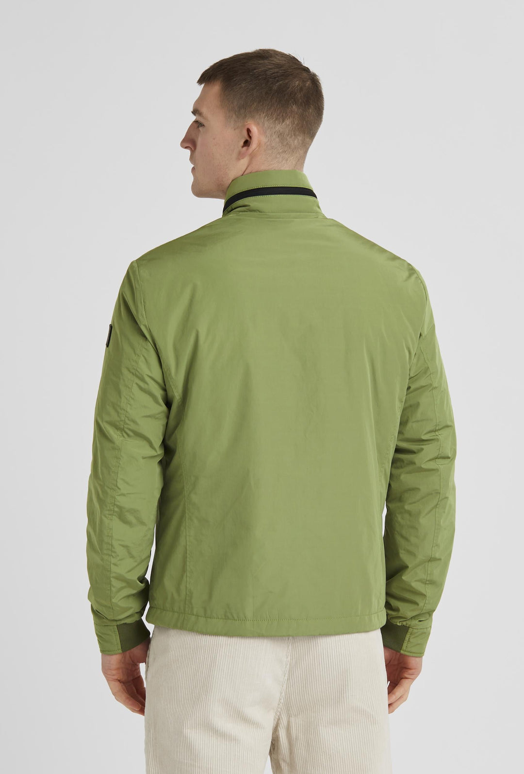 Grüne Jacke mit Reißverschluss, Rippbündchen und Stehkragen