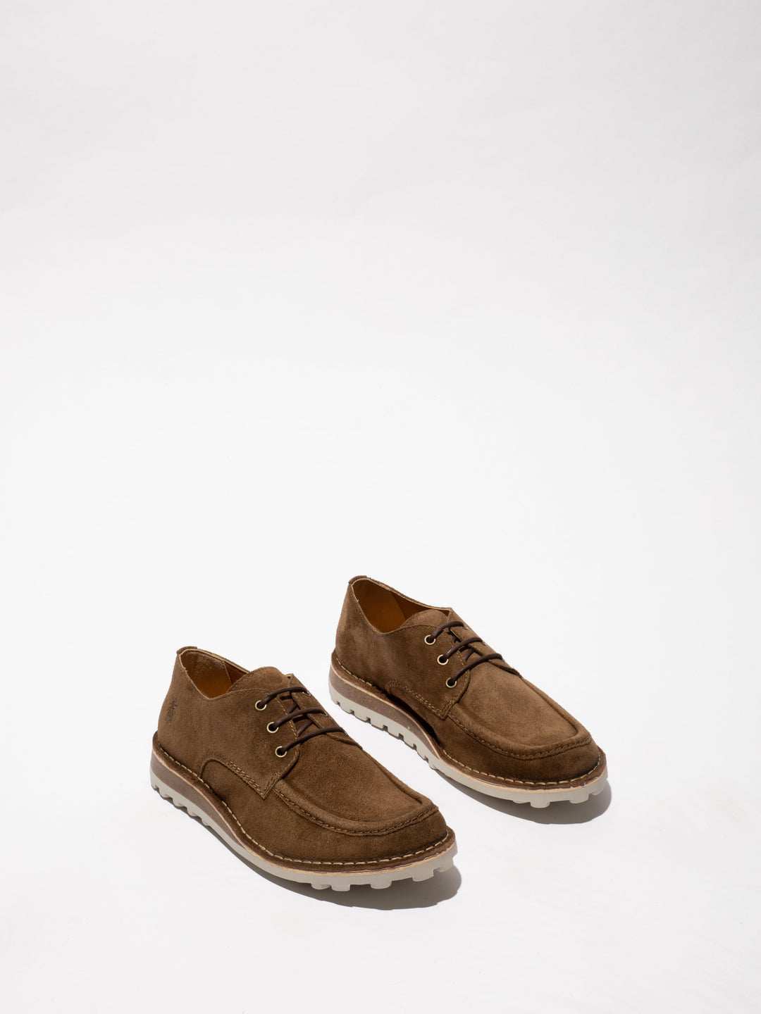 Brown Shoes with a Contoured Sole and Decorative Stitching