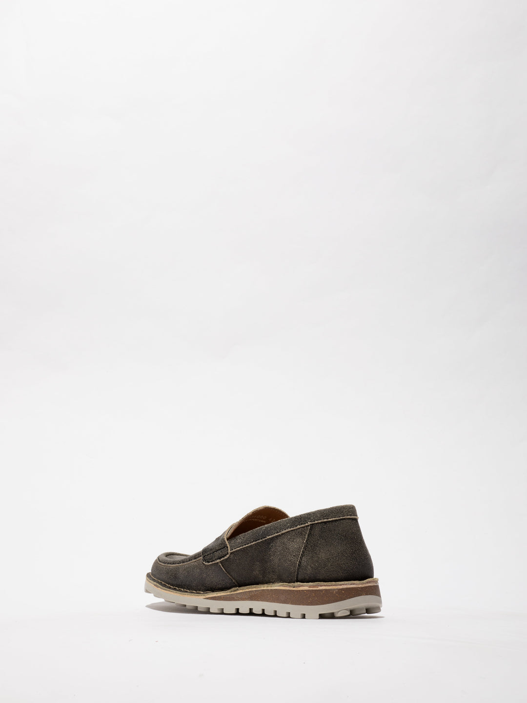 Brown Shoes with Decorative Stitching and a Two-Tone Sole on a Slight Platform