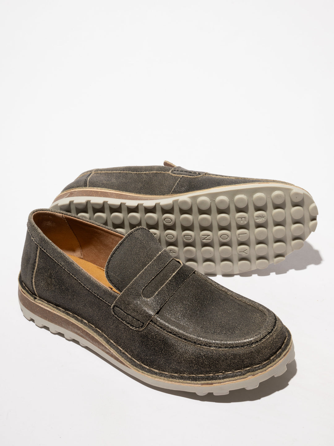Brown Shoes with Decorative Stitching and a Two-Tone Sole on a Slight Platform
