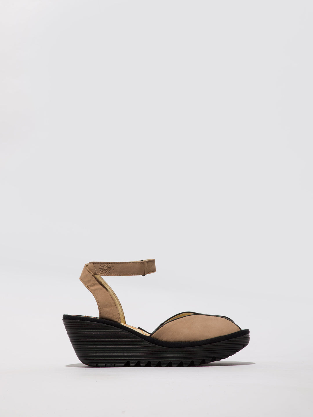 Brown Shoes with a High Wedge and Ankle Fastening
