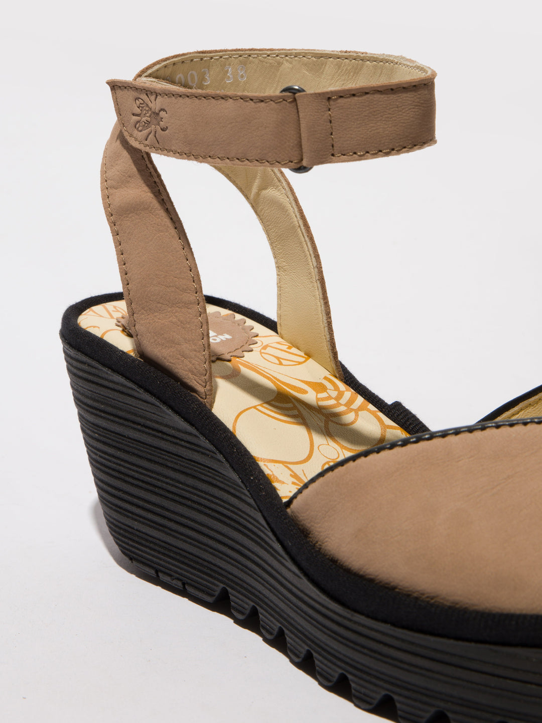 Brown Shoes with a High Wedge and Ankle Fastening